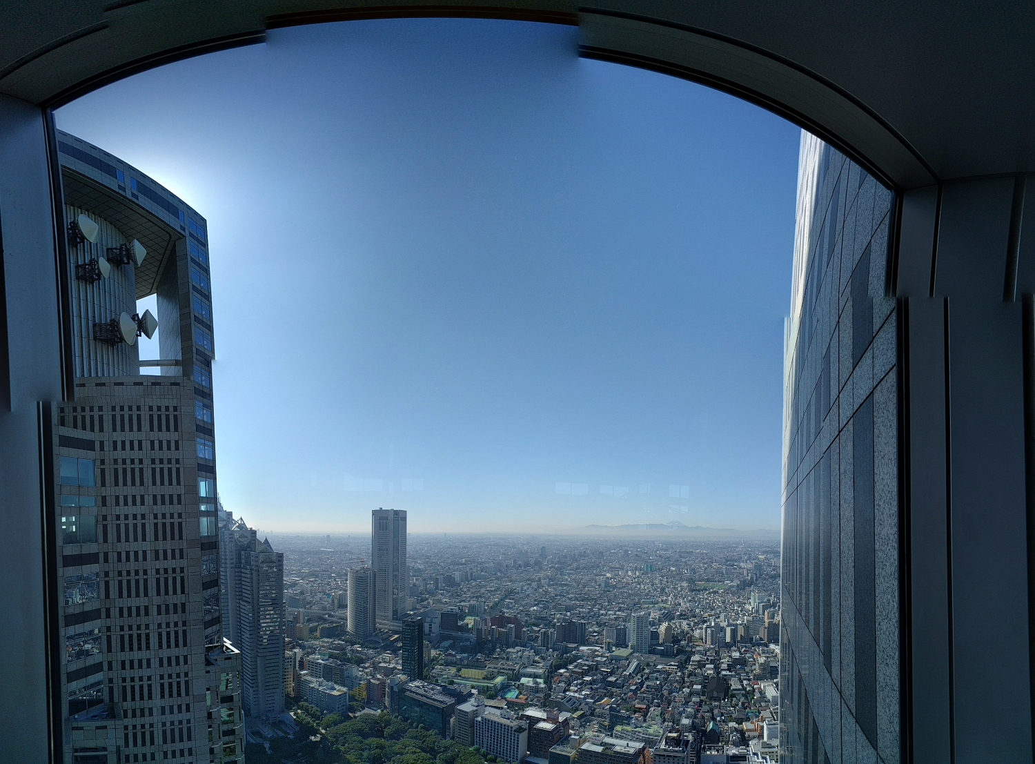 View of Tokyo from the observation tower. You can just make out Mt. Fuji in the distance under the reflection spots&nbsp;