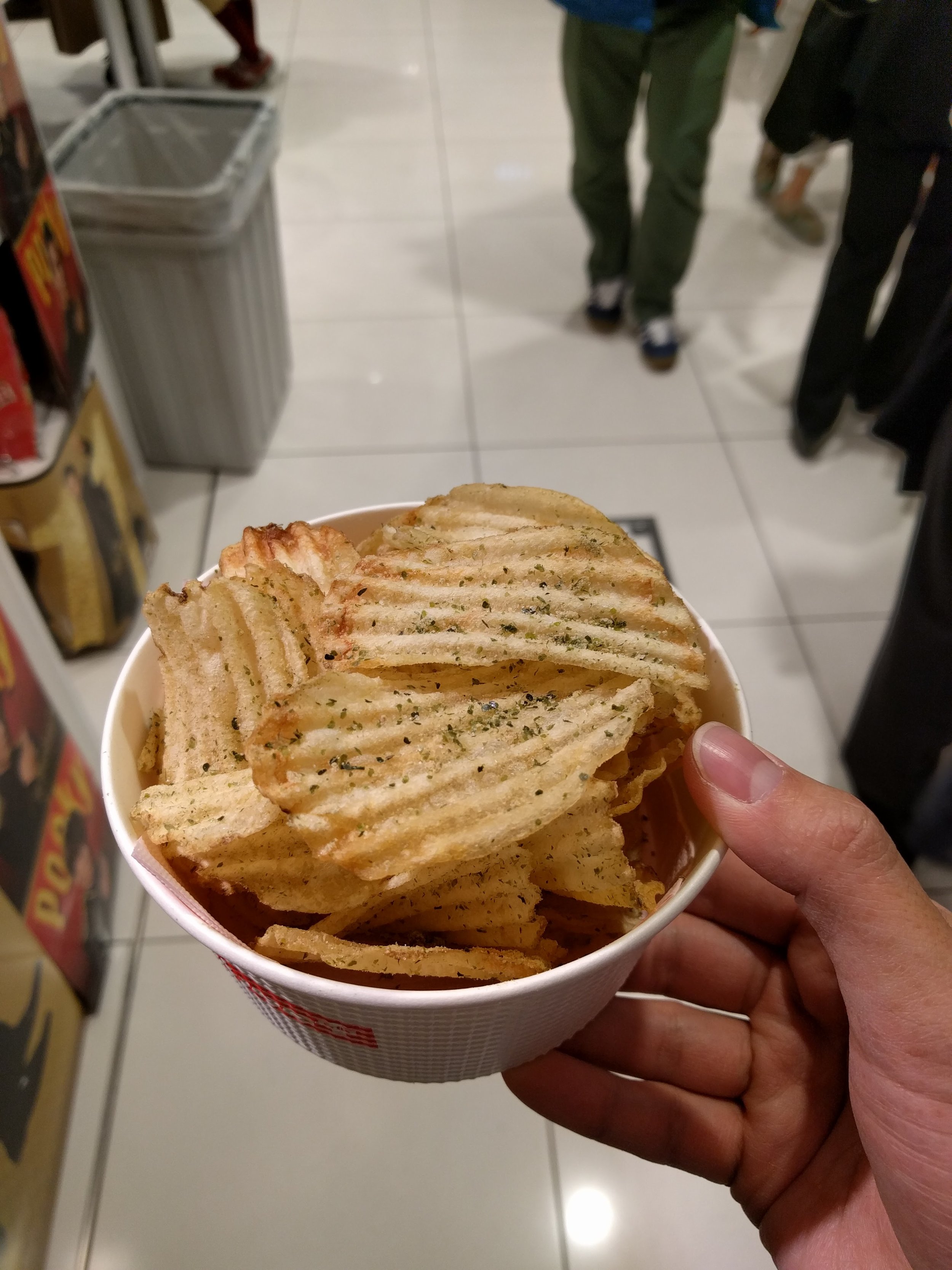 <p>Underneath Tokyo station, there's a Calbee store that makes fresh potato chips. Yum. This only lasted the 5 minute walk to the Shinkansen train we were taking to Kanazawa.</p>