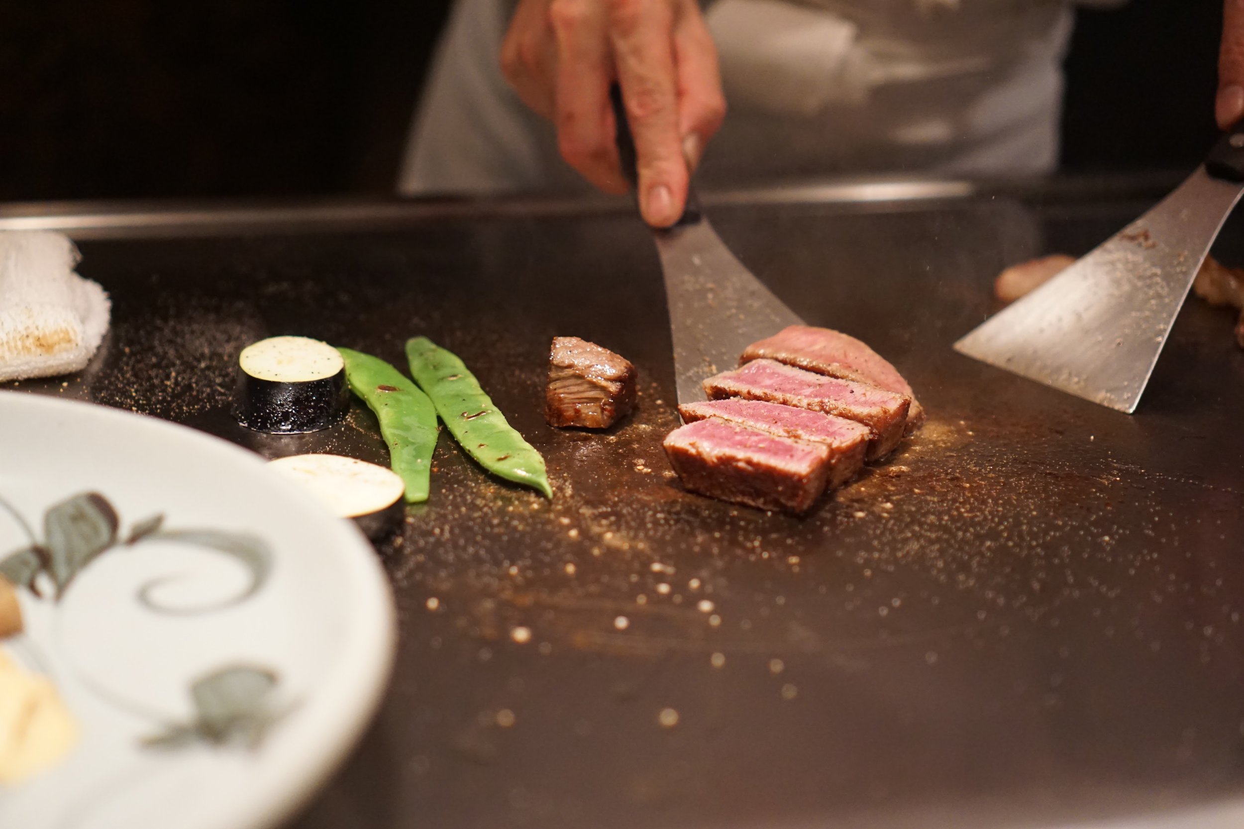 quickly searing off the meat to a perfect medium rare
