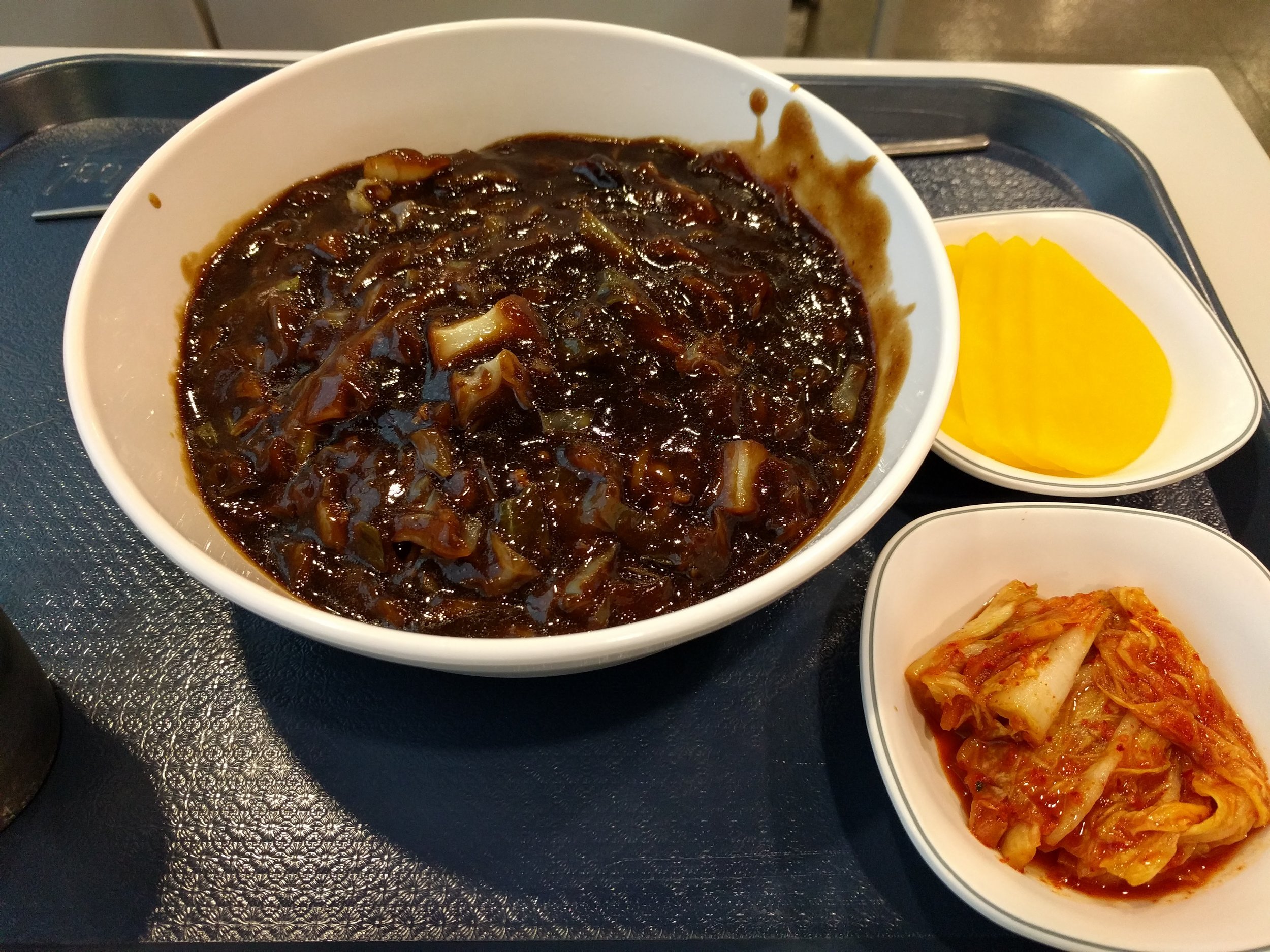 <p>Korean Chinese food from the food court. Jajangmyeon = zha jiang mian = black bean noodles. It tastes reminiscent of the Chinese version yet also very different</p>