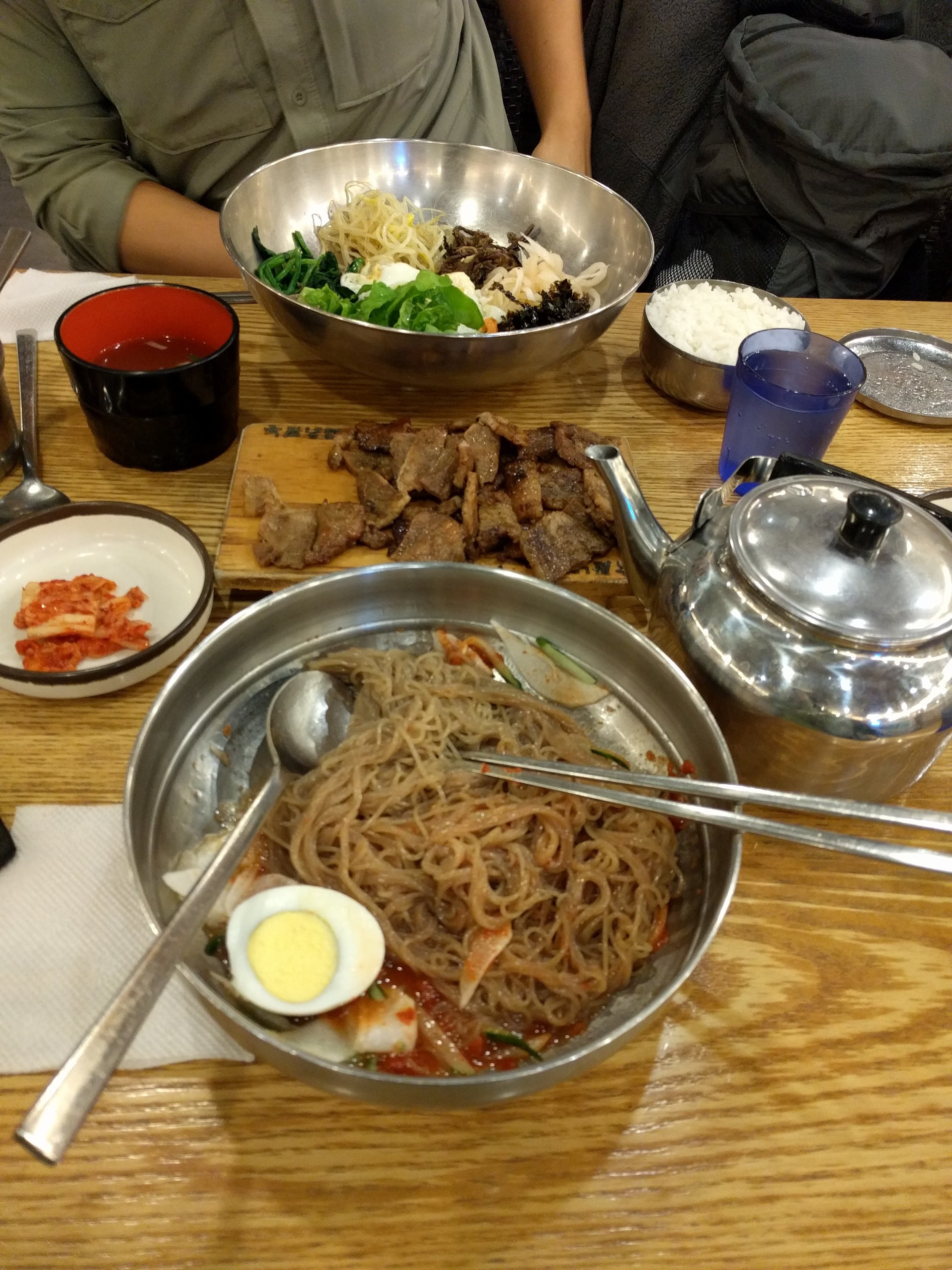 <p>Went downstairs into a random place in Gangnam that was all in Korean. Eric got a bibimbap but everyone else got this noodle thing so I did too. I've never had naengmyeon before but I love it! It's light and refreshing yet deeply flavorful. They gave me scissors but I didn't realize until halfway through eating that it was to cut the noodles, whoops</p>