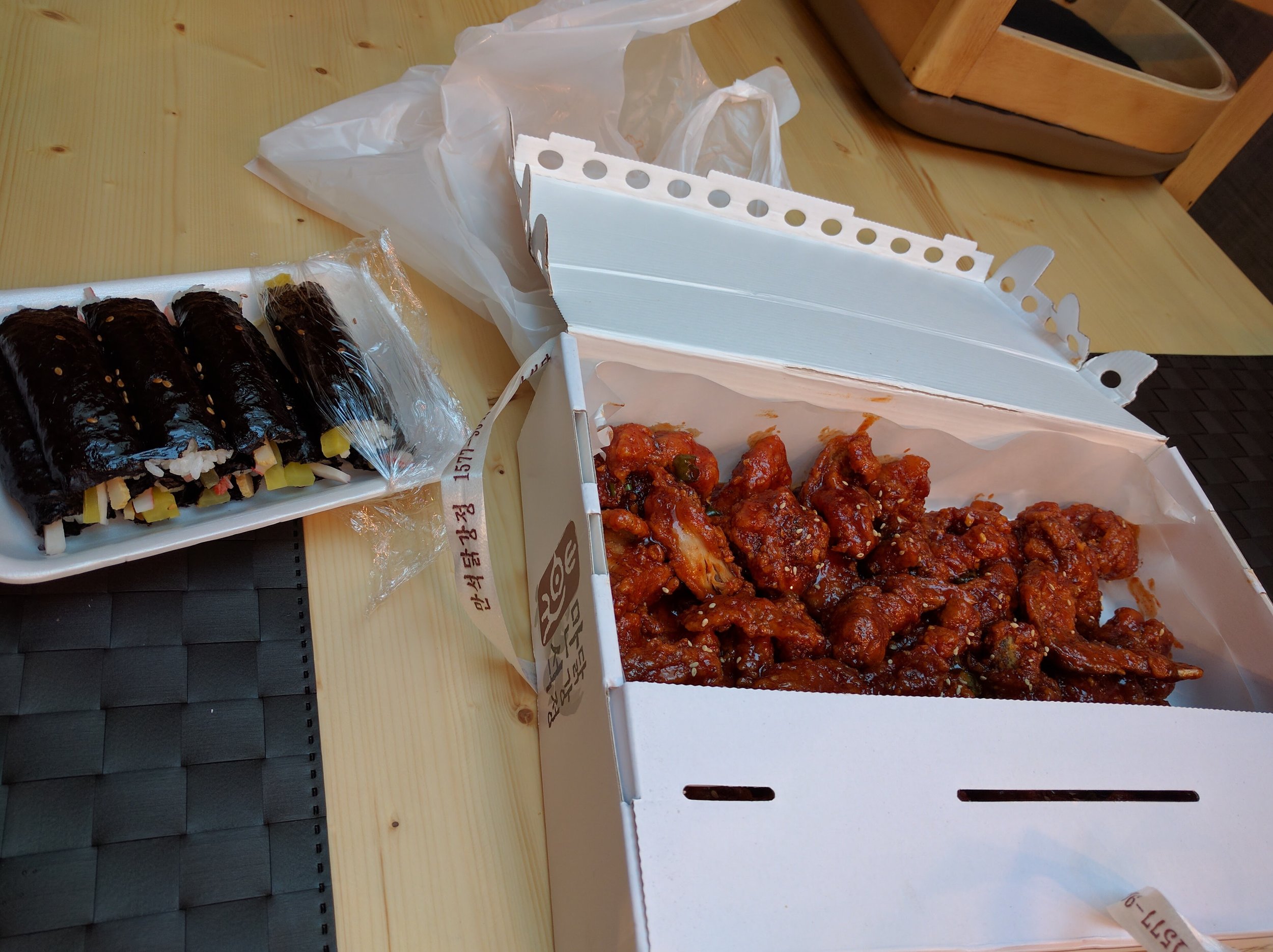 <p>At the market in Sokcho, there was a whole section of fried chicken places and it smelled so good after our hike, we couldn't resist getting some. We got some gimbap as well to get in some veggies :)</p>
