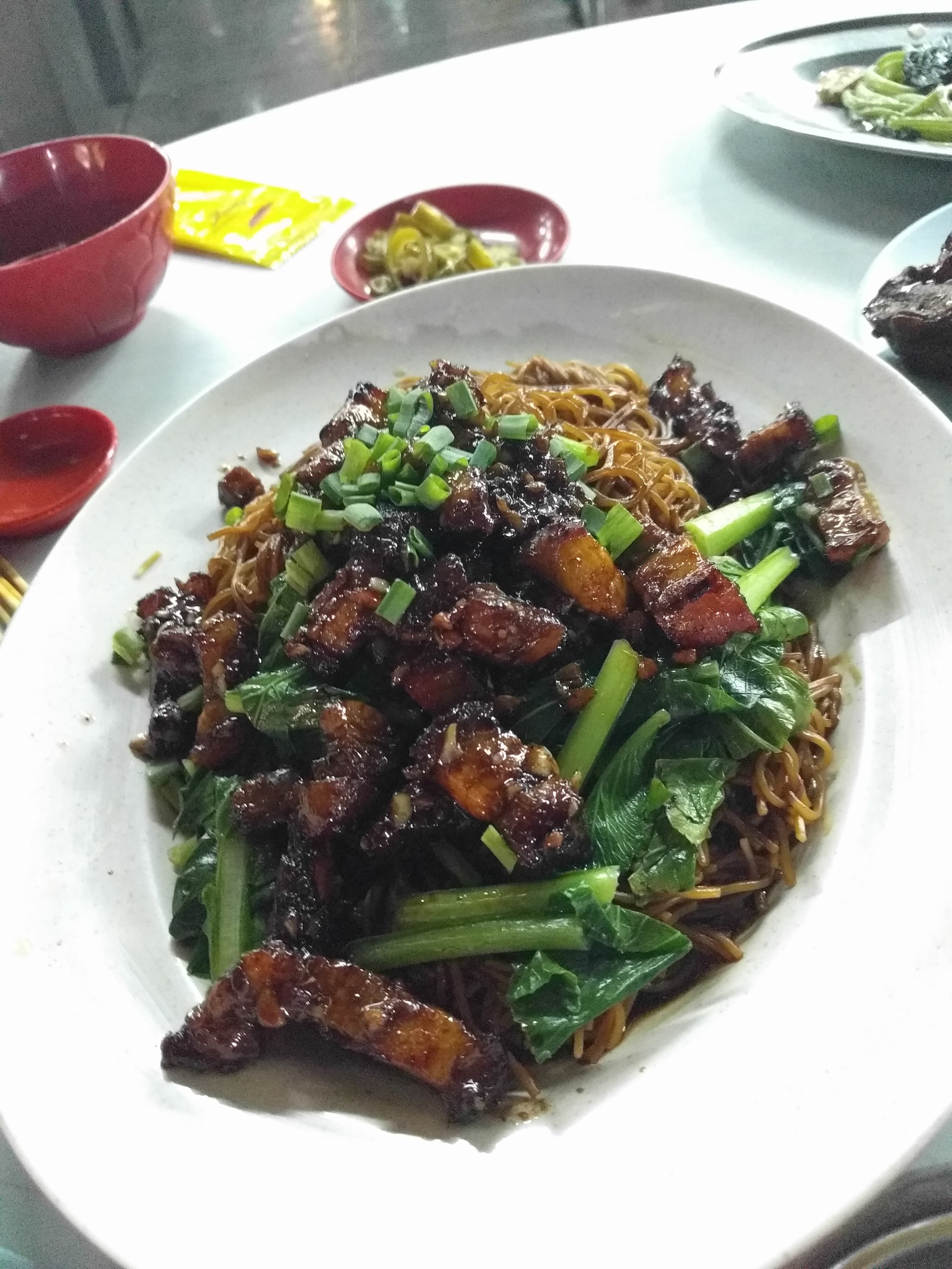 Fried pork belly over noodles