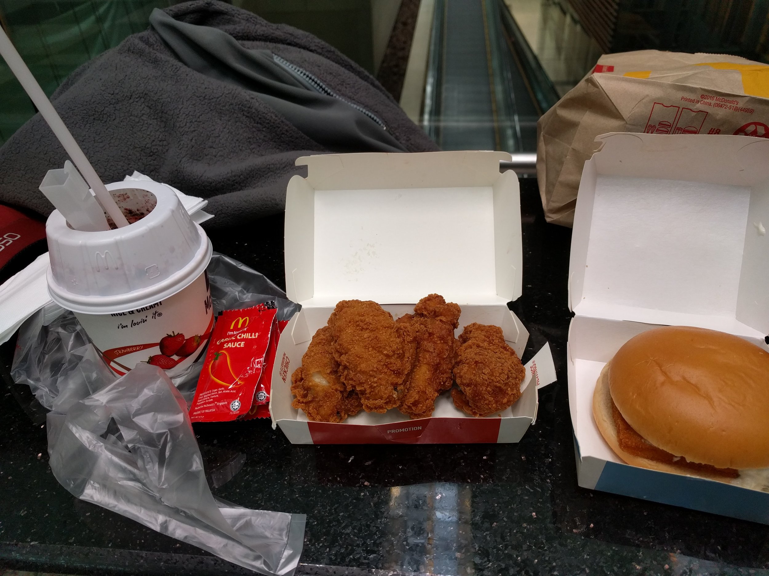 <p>Kinda sorta trying to eat McDonalds in different countries. We got a strawberry mcflurry (good0, spicy chicken wings (decent, not that spicy), and what I hoped was a "nacho" filet-o-fish which was just a normal one :/</p>