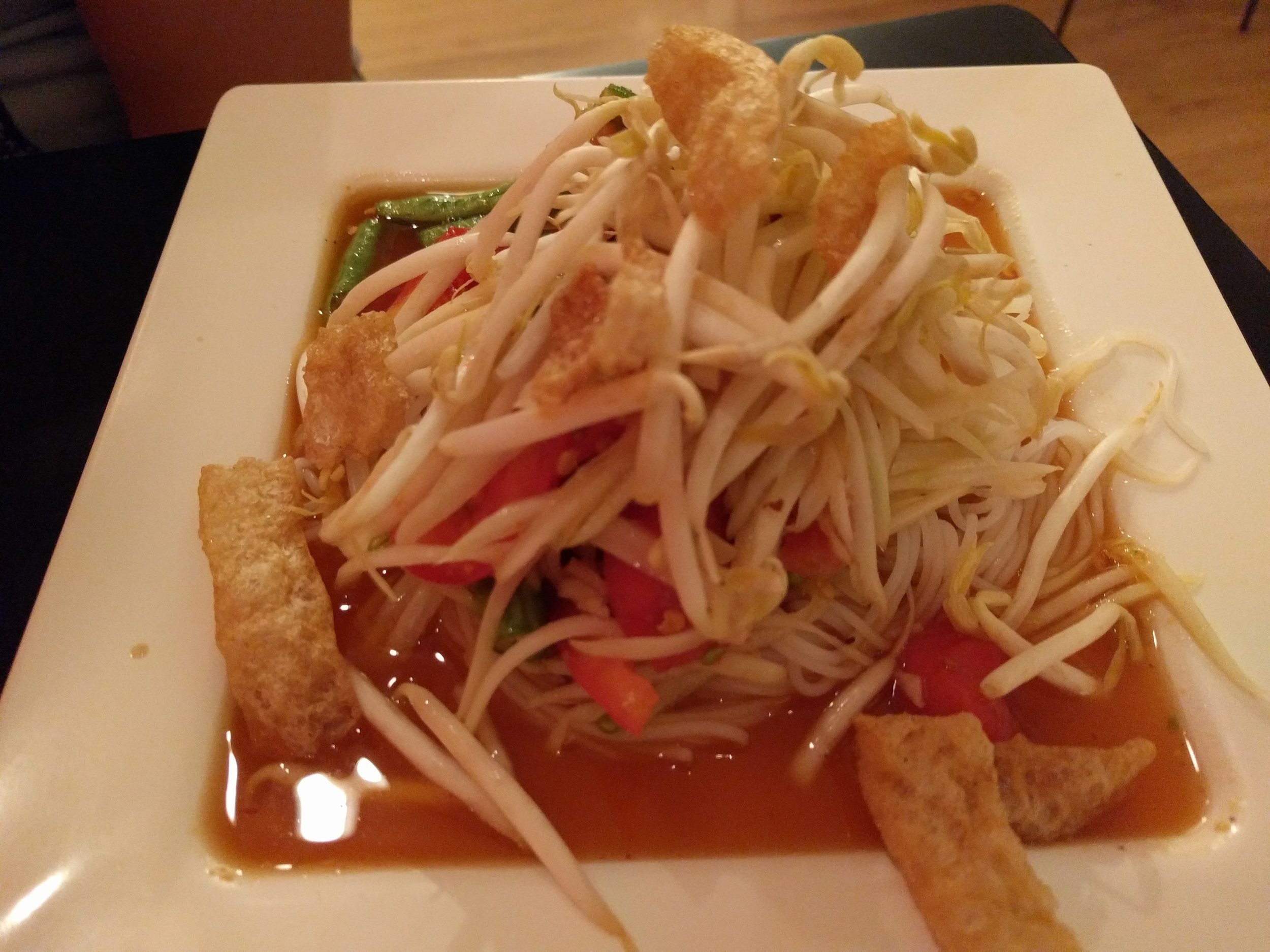 Sweet chili som tum with pork rinds at Som Tum Der