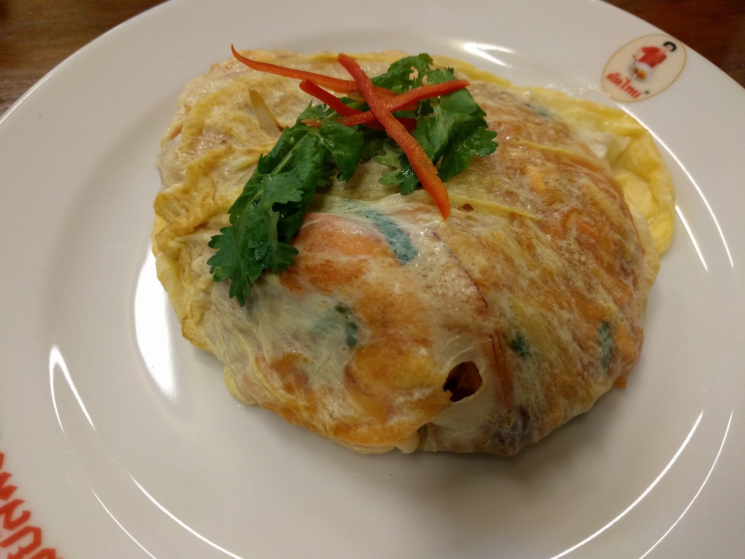 Pad thai wrapped in omelet at Thip Samai