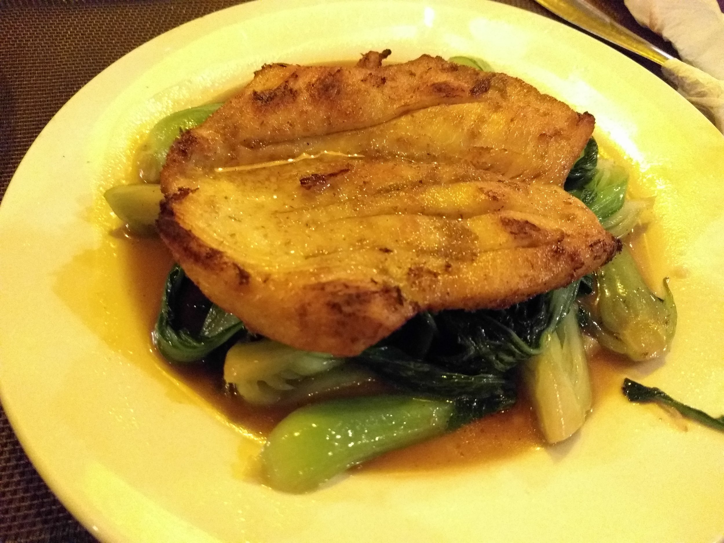 Khmer chicken over bok choy