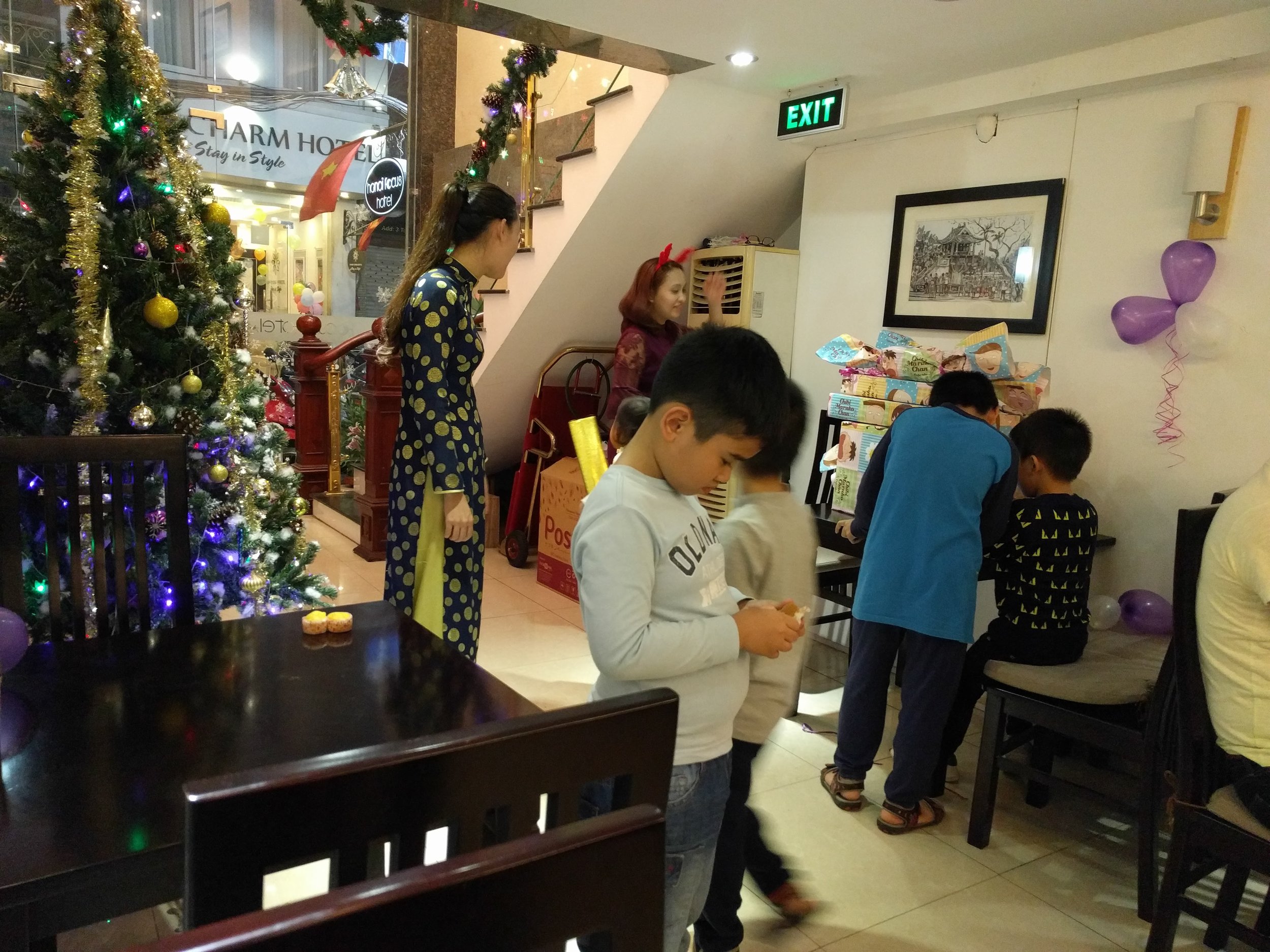 Staff's kids opening presents