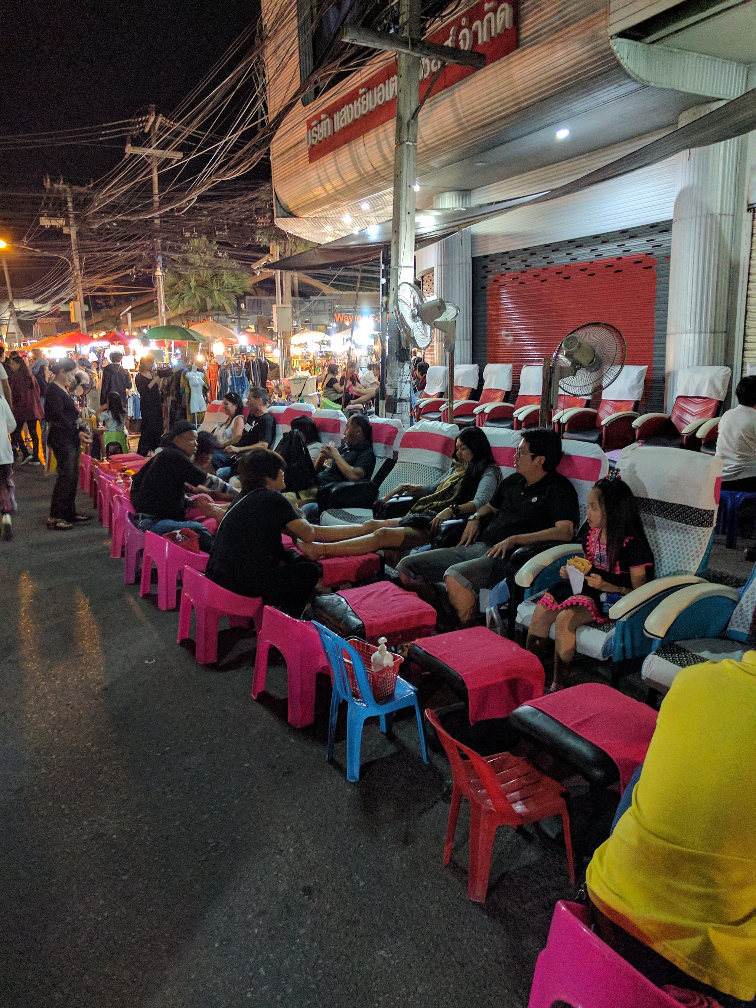 lots of people getting a street massage to get ready for NYE