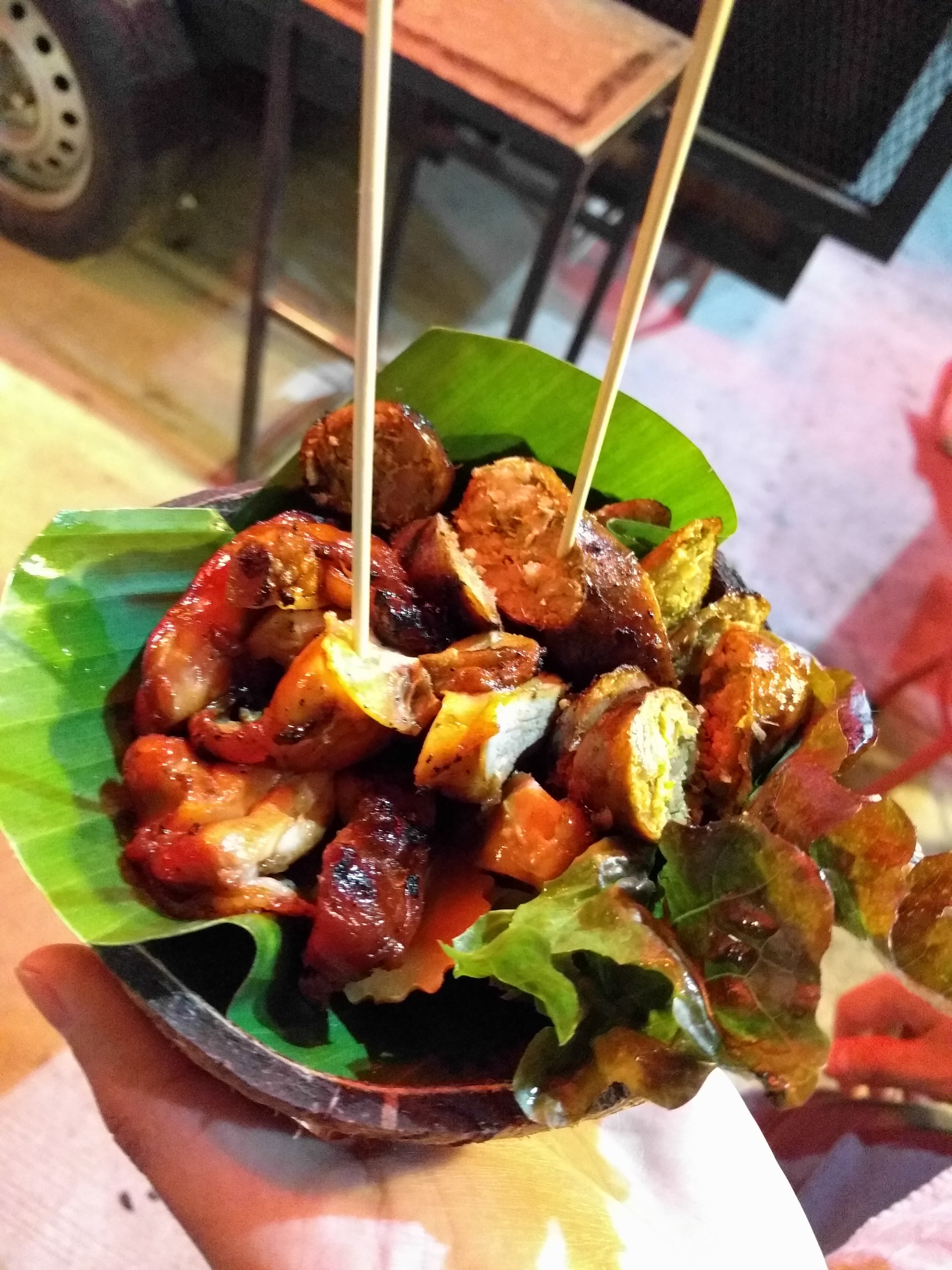 grilled chicken thigh and chiang mai sausage