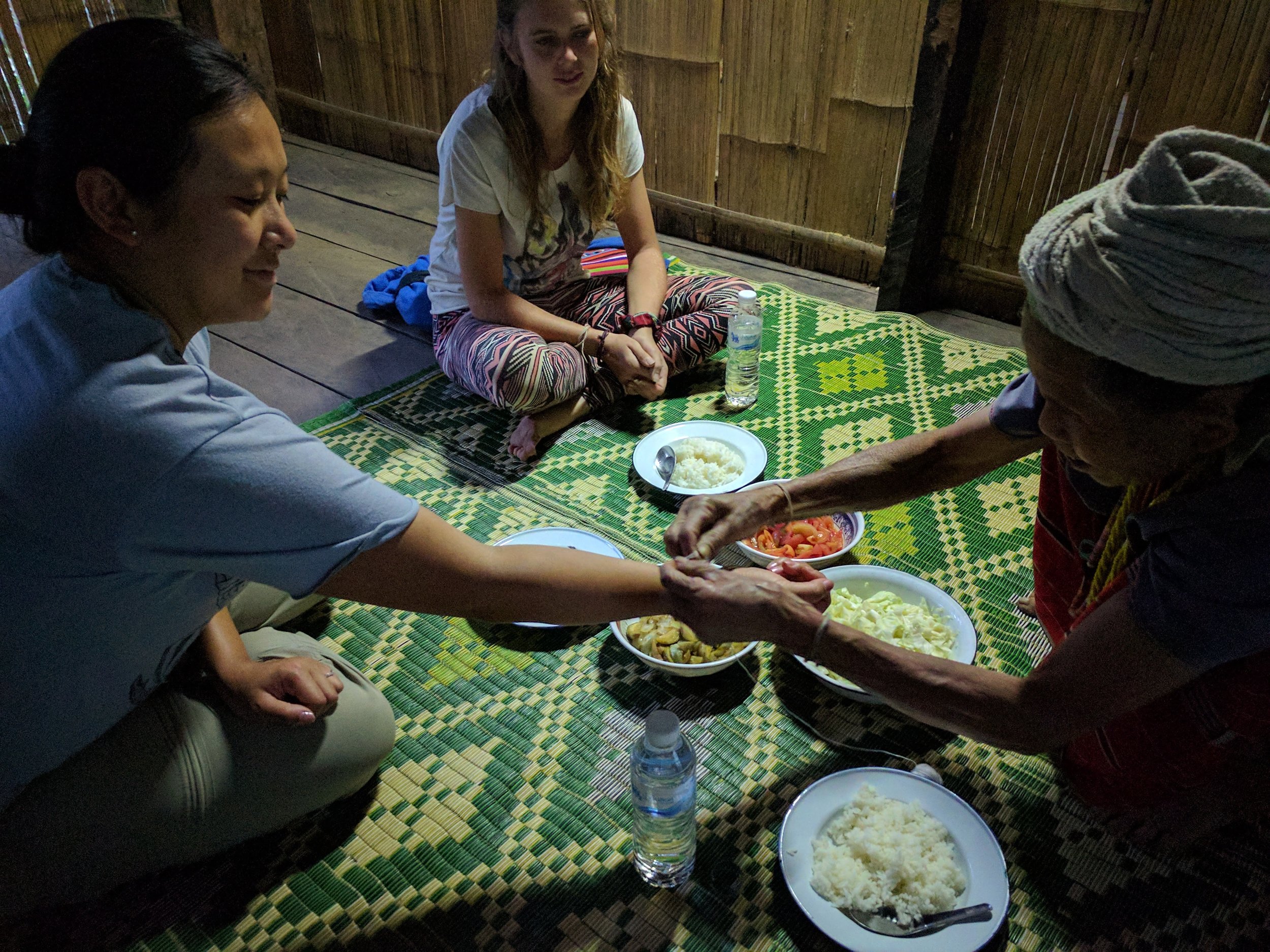 Wrist string tying ceremony before the meal