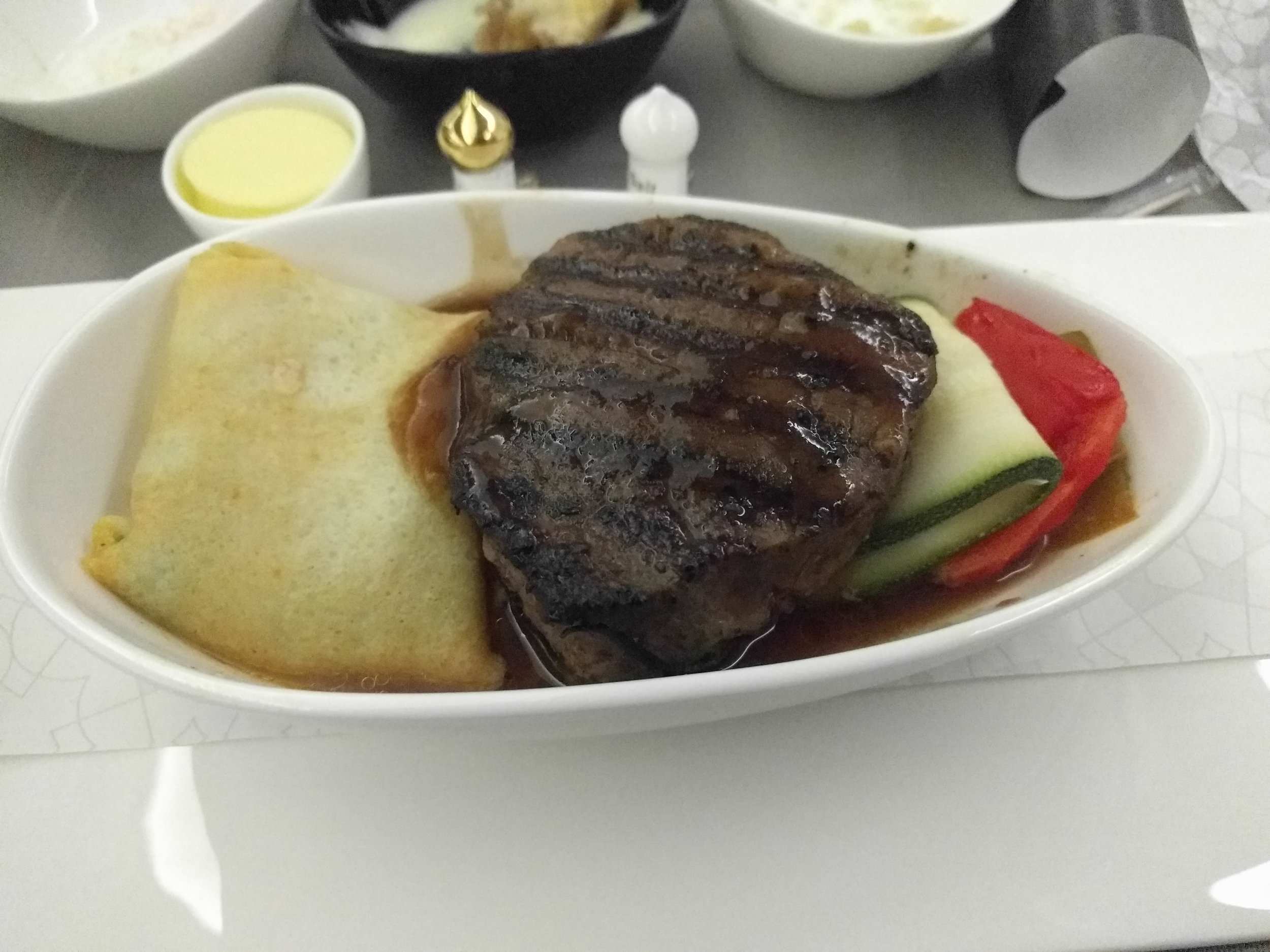 Steak with a packet of spinach