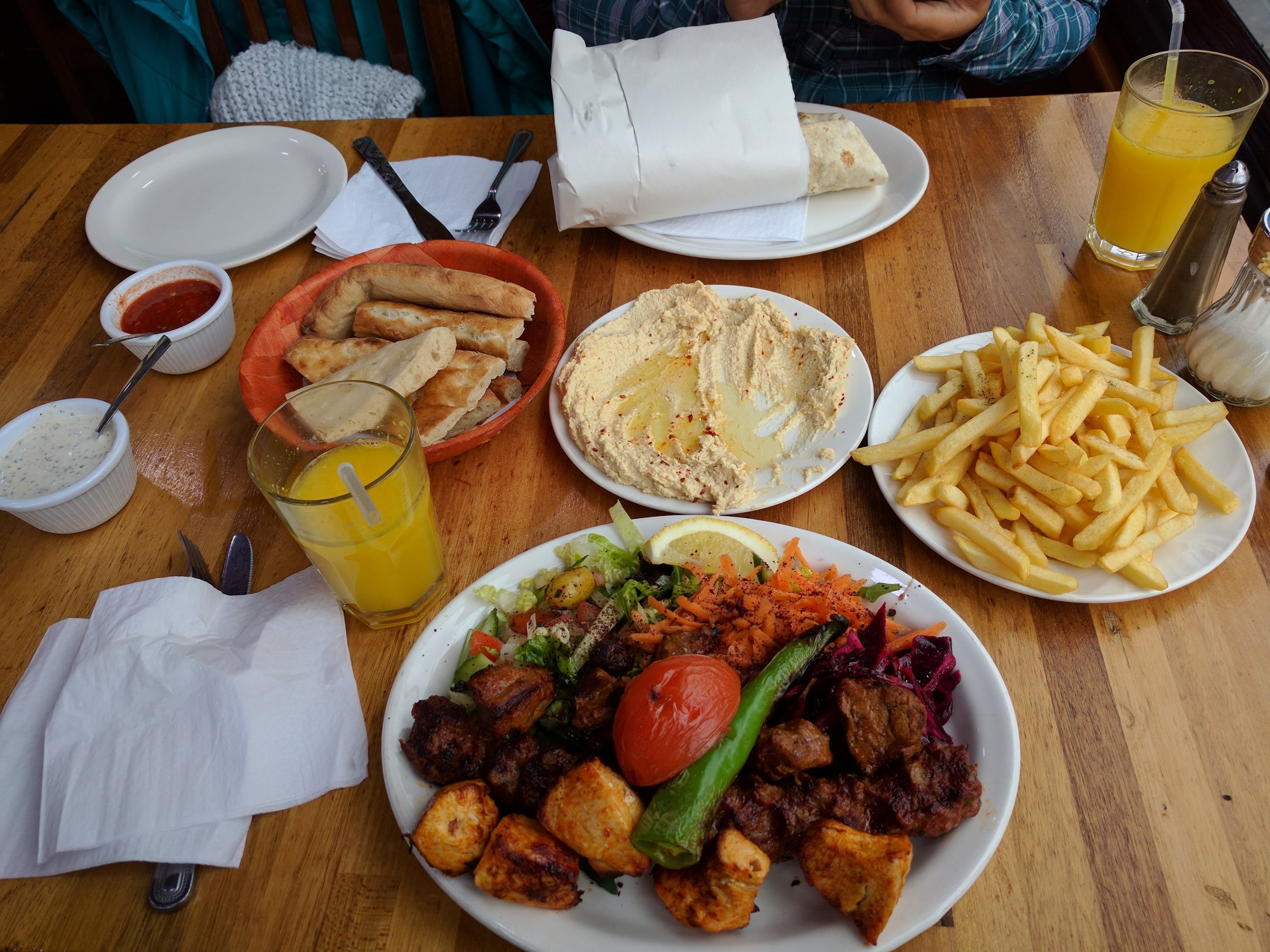 Kebab grill plate, hummus, fresh OJ