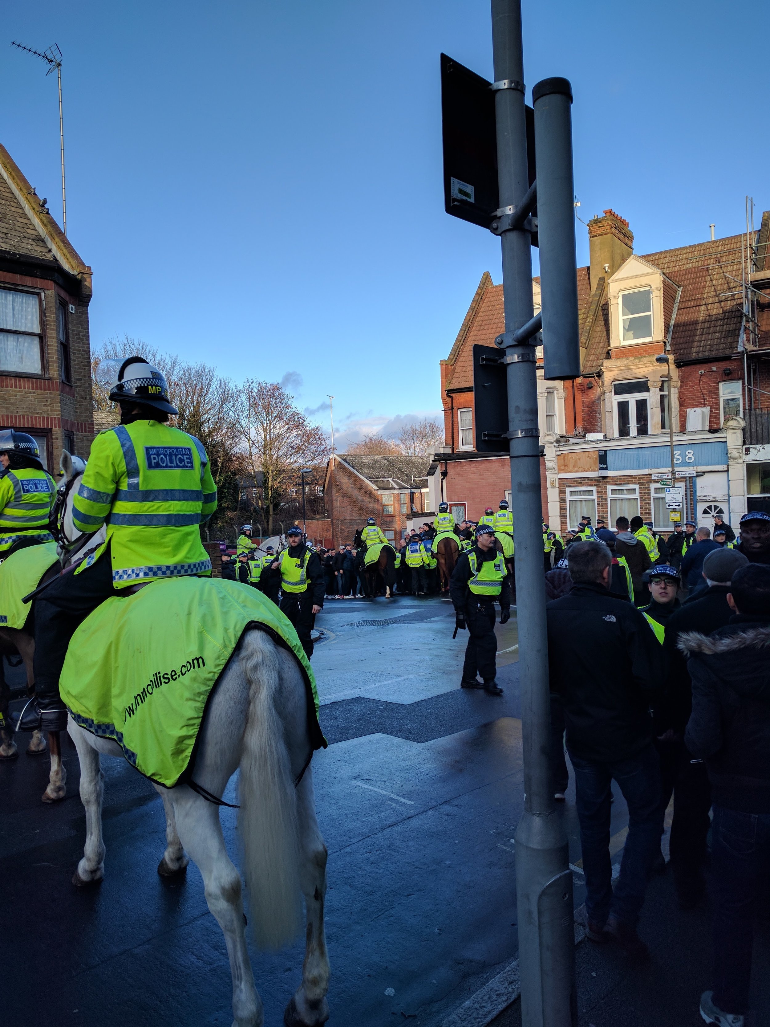 Police separating the Charlton and Millwall fans