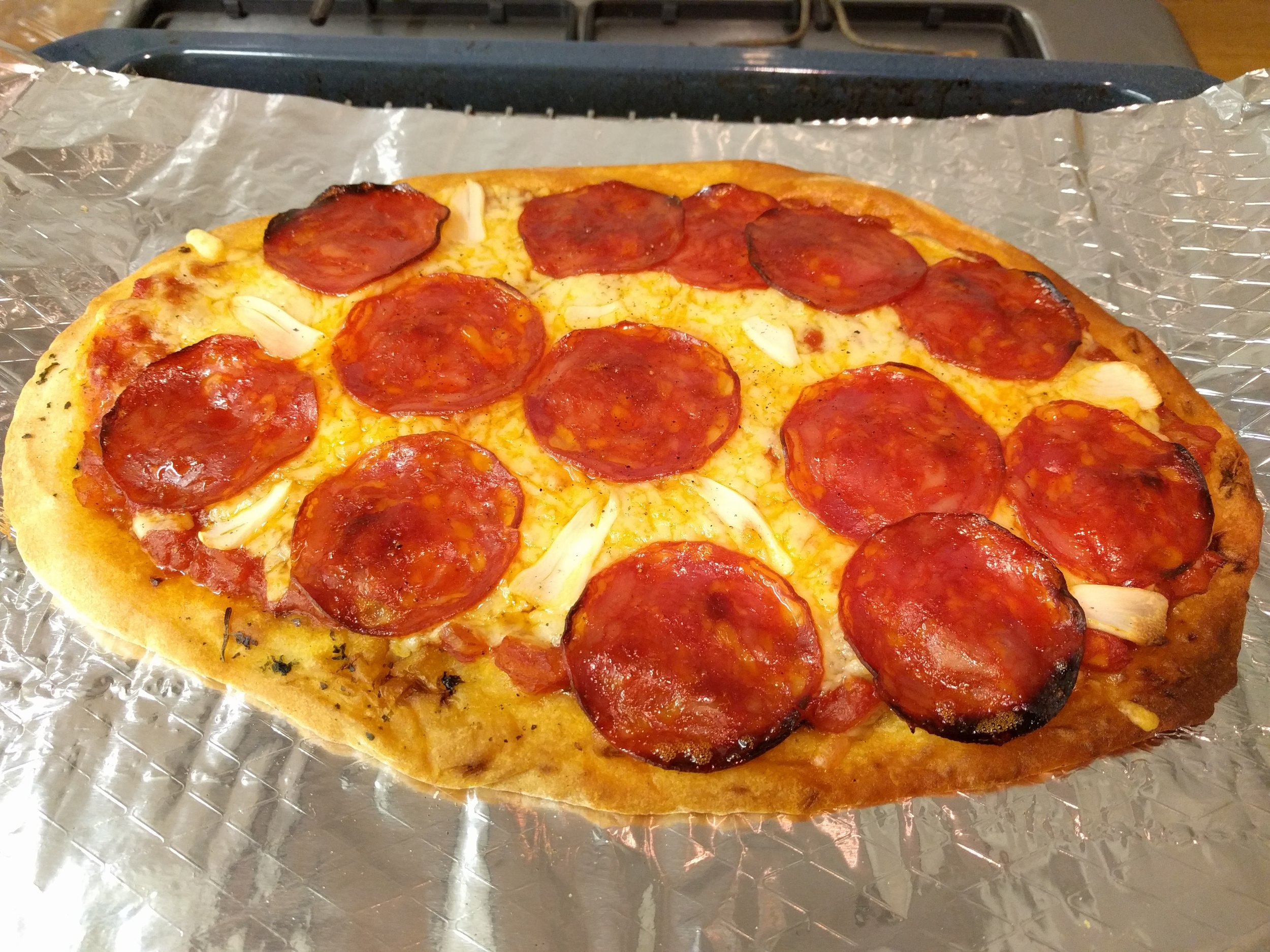 <p>Naan from a local turkish grocer, then chorizo and cheese, and we made a quick sauce with crushed tomatoes, onions garlic and tomato paste.</p>