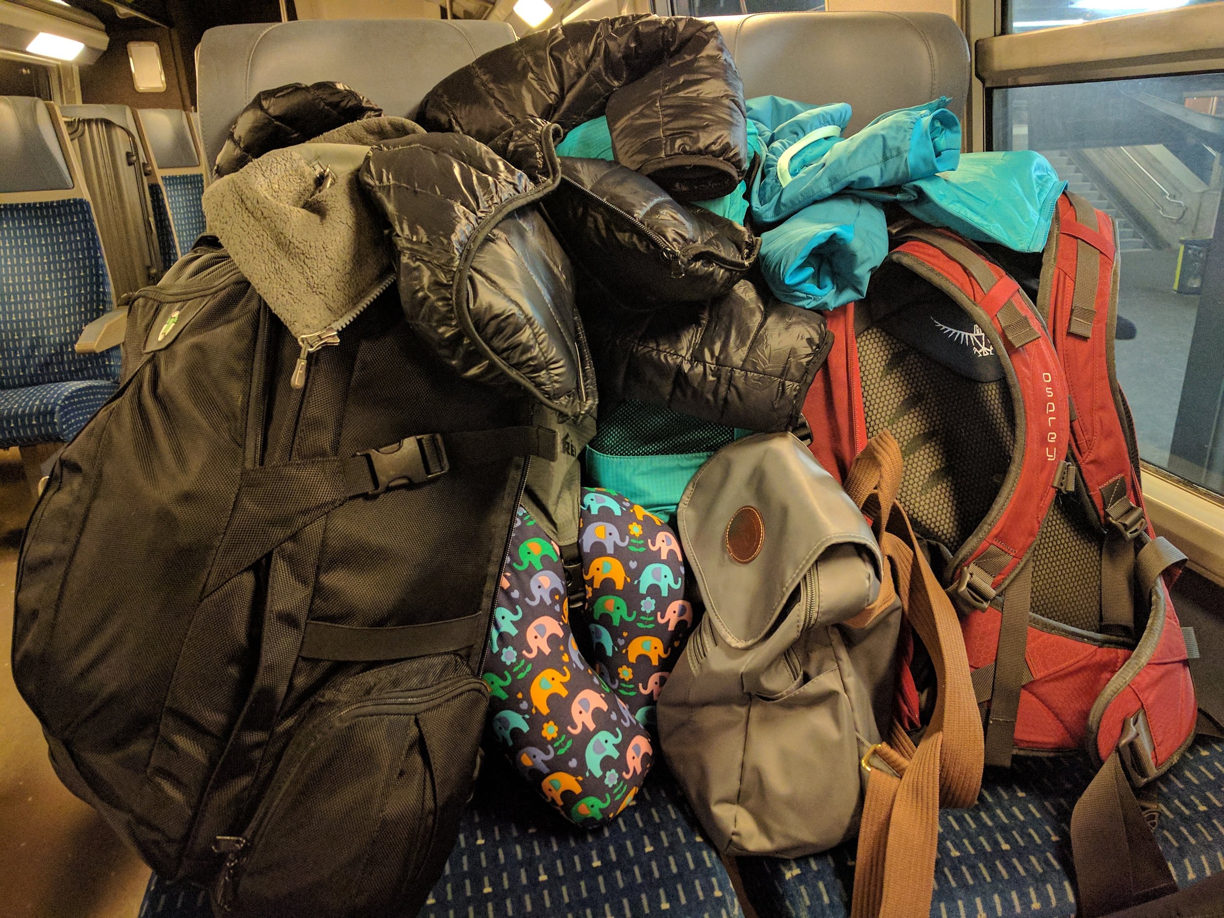6.5 months of clothes and stuff, on two chairs