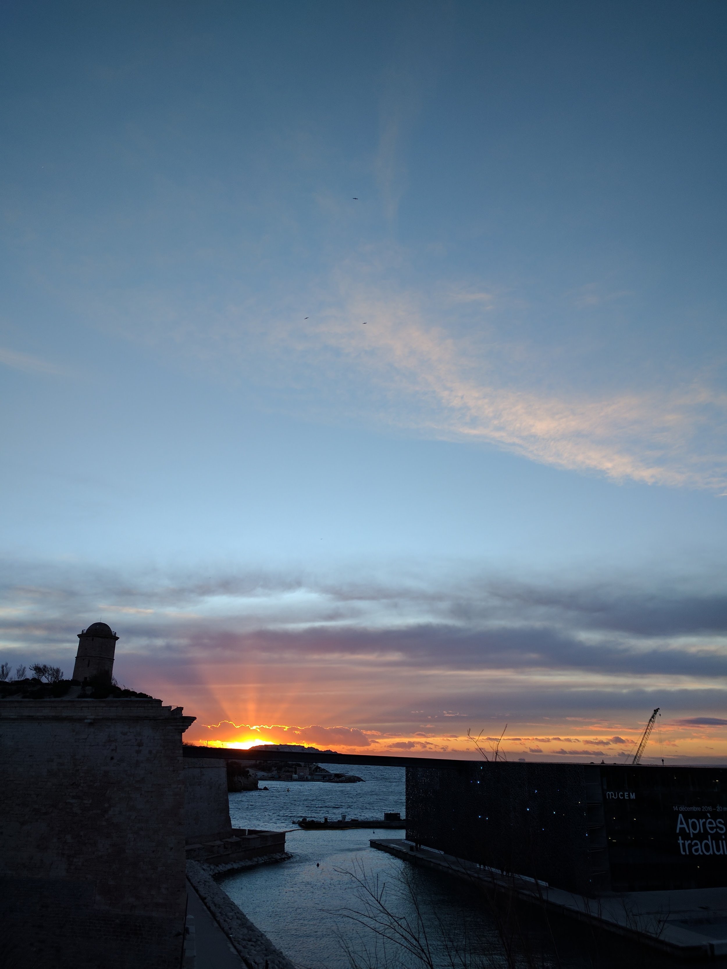 Sunset over the harbor from the cathedral plaza