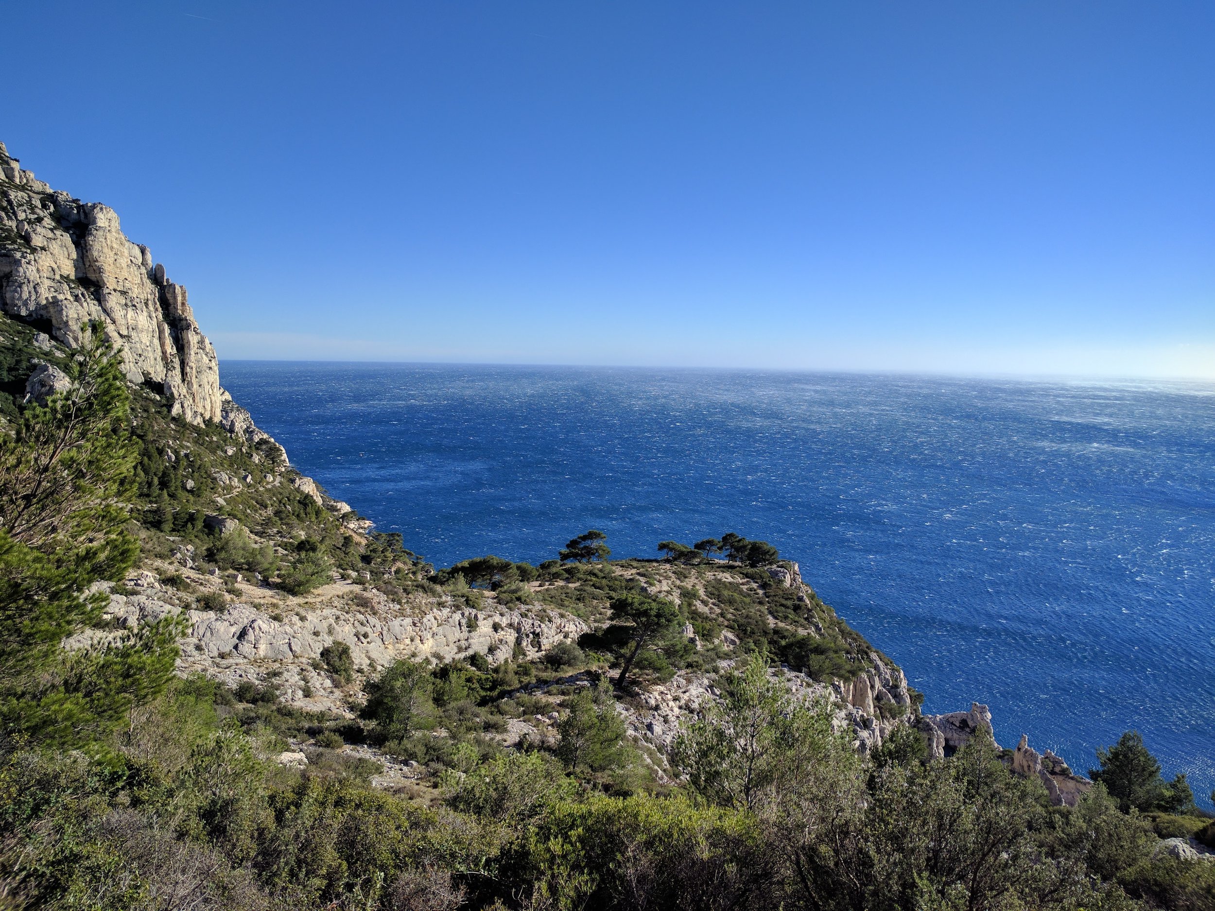 <p>We didn't make it down to the water, but somehow ended up down at that point that juts out, which offered some great views of the coast line and Calanque du Sugiton</p>