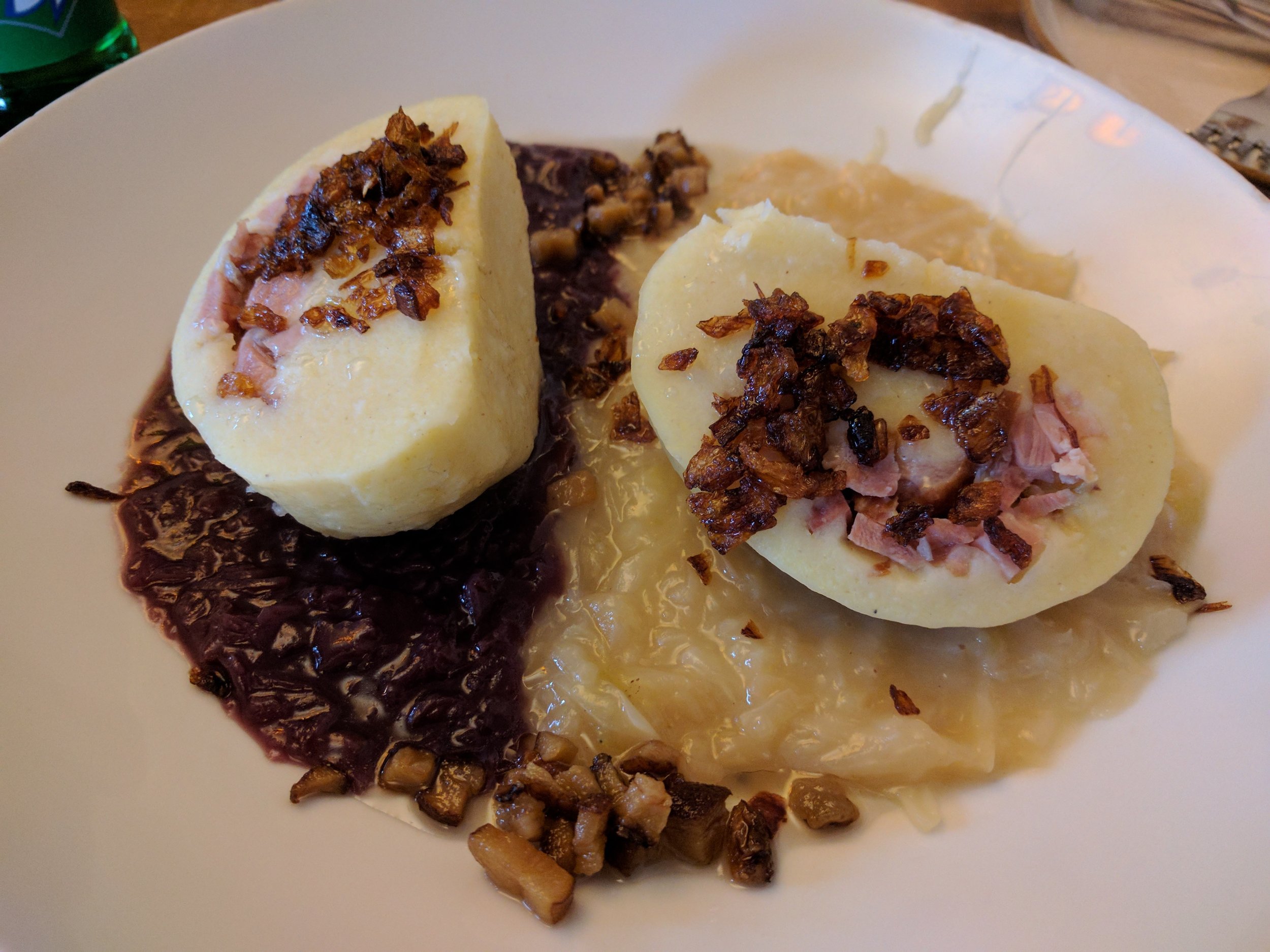 Bacon stuffed potato dumpling with red and white cabbage