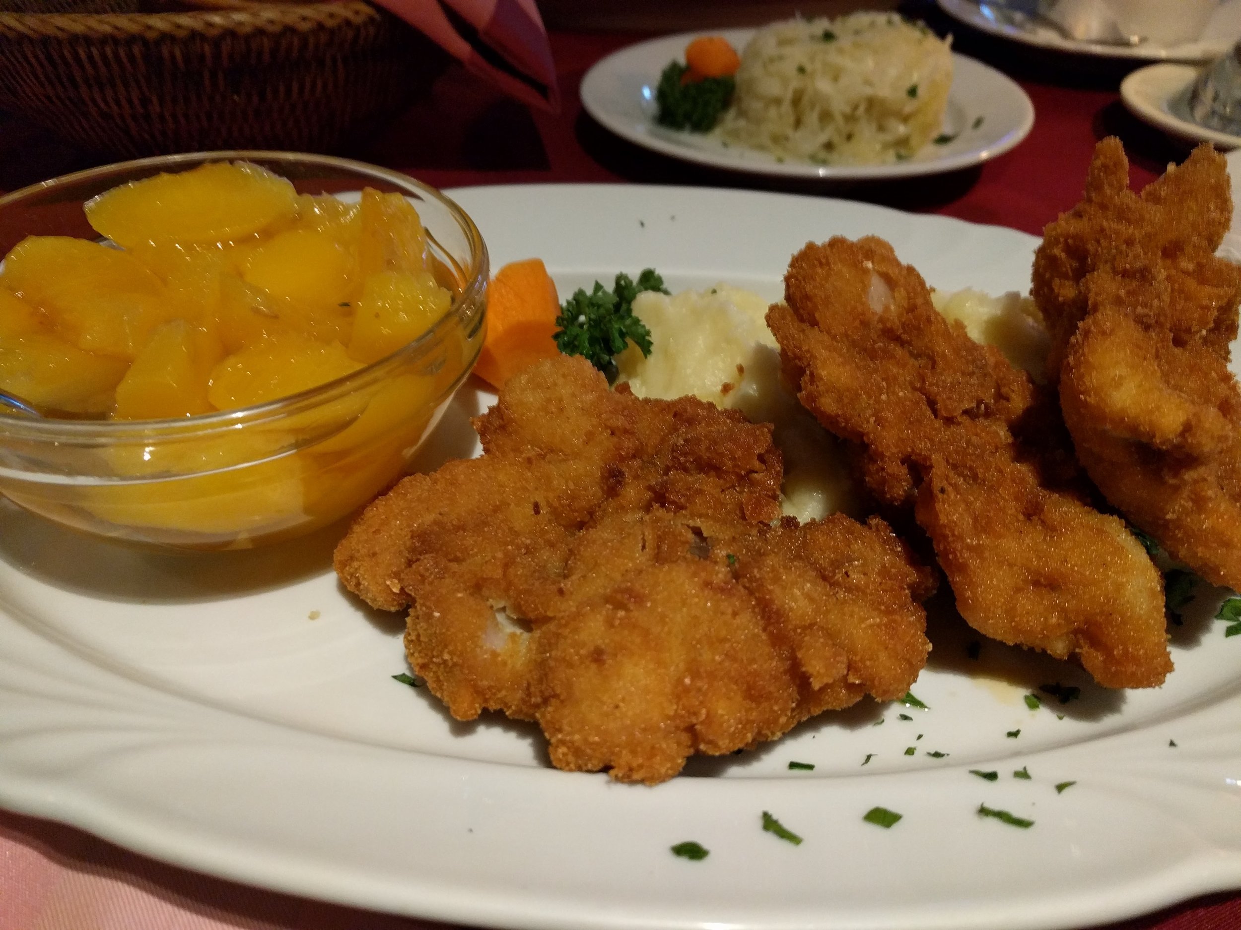 Fried chicken thigh, potatoes, and peaches - Tabáni Gösser