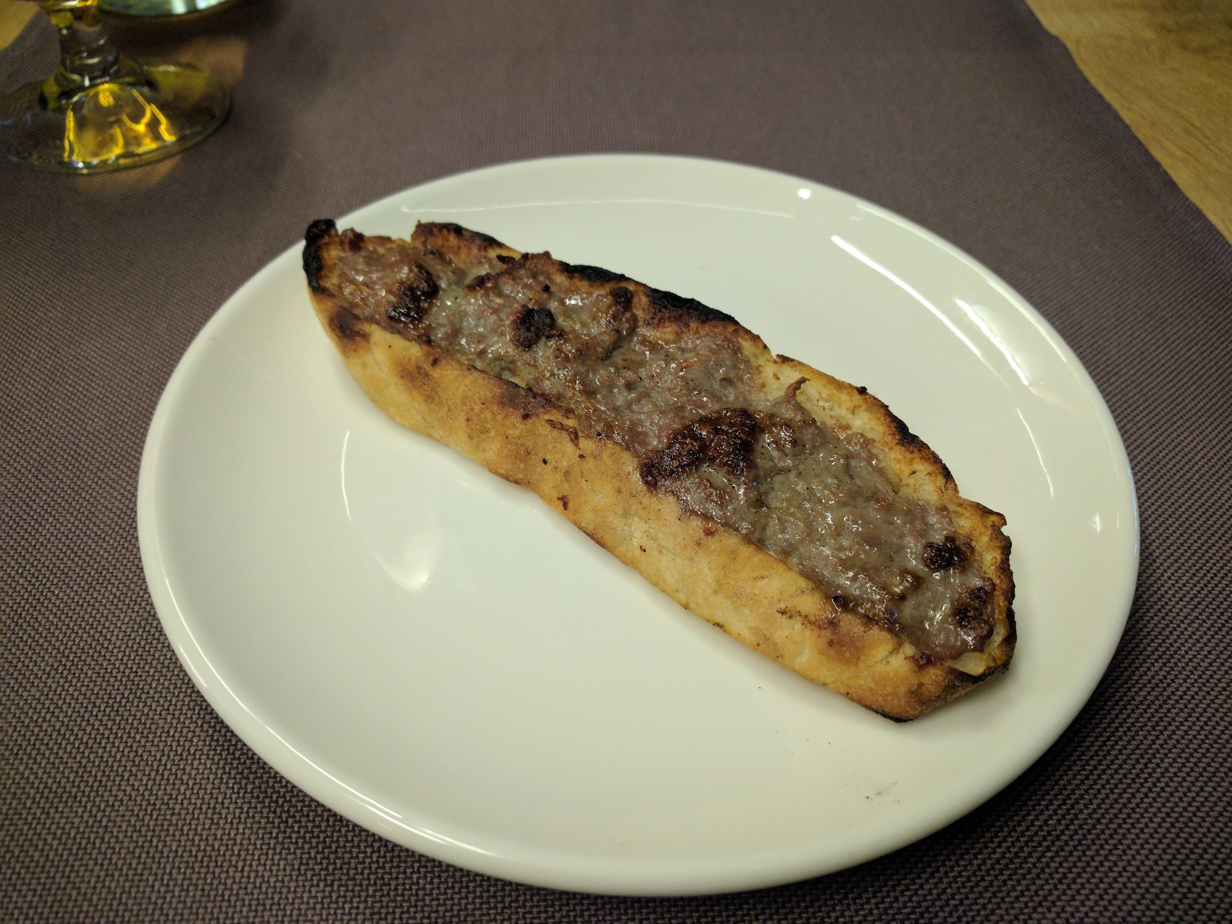 <p>Meat paste, toasted on top of crusty bread? Yum</p>
