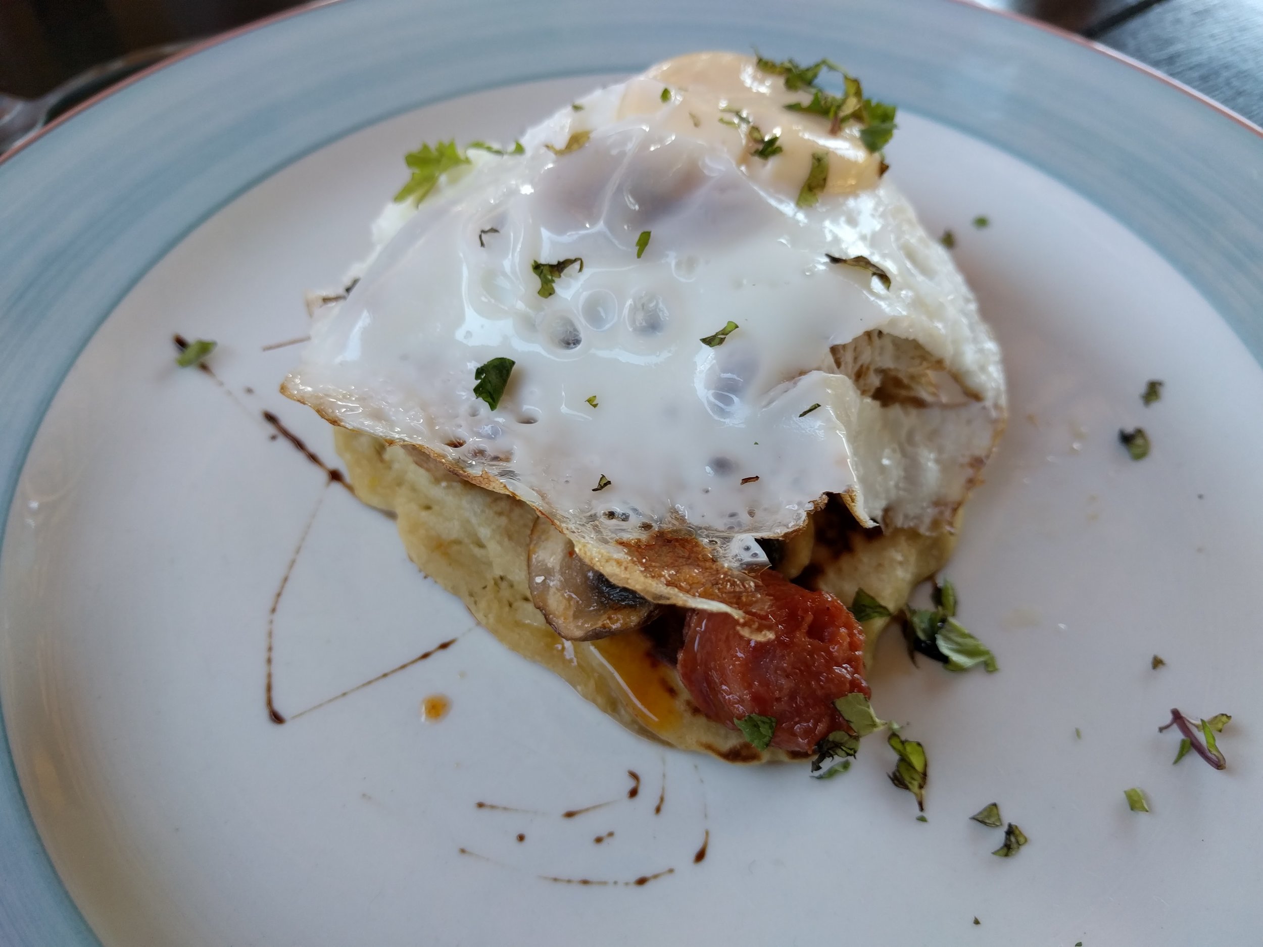 Flapjack with egg, sausage, and sundried tomato paste