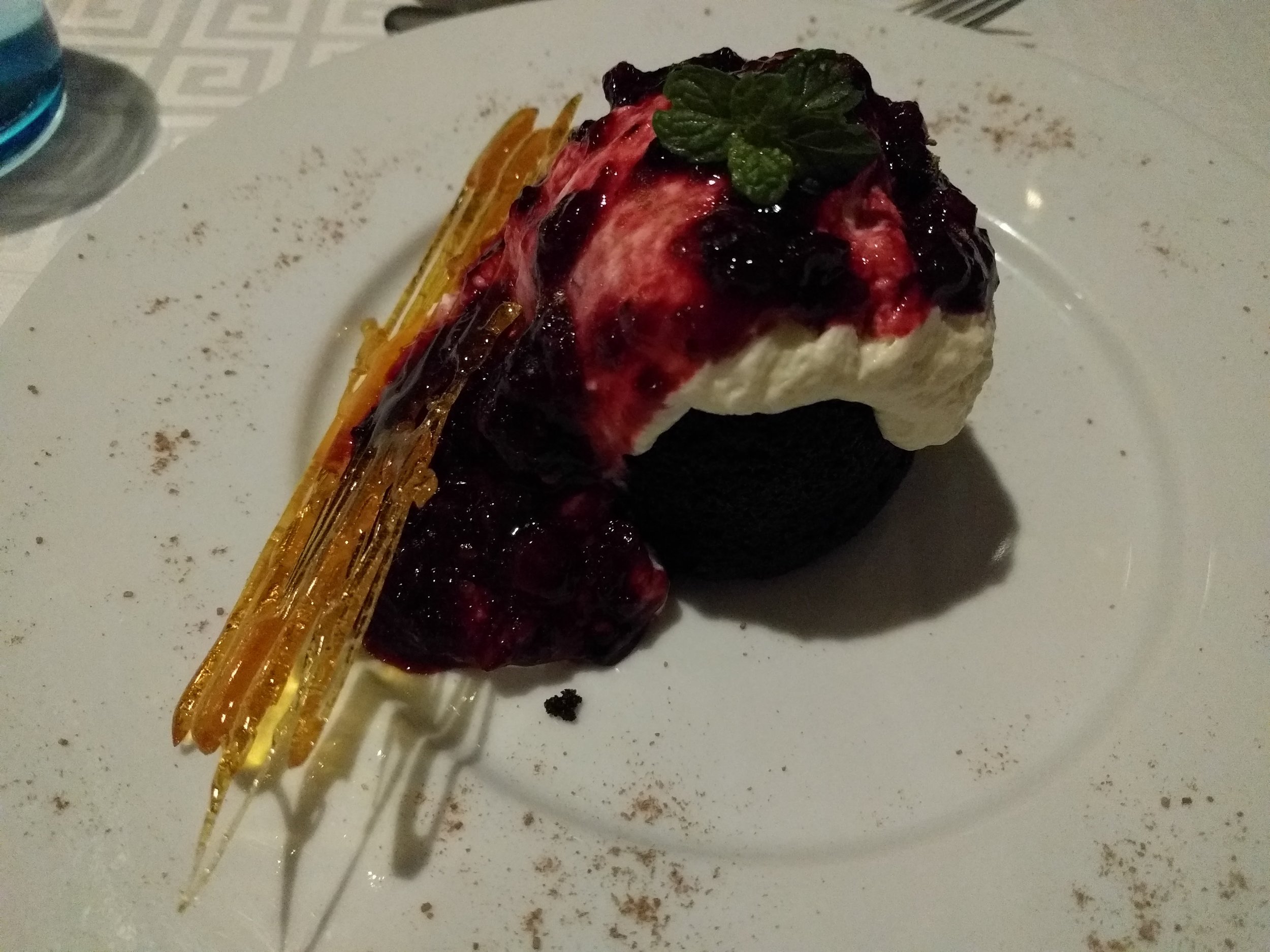 Chocolate cake with berries and cream